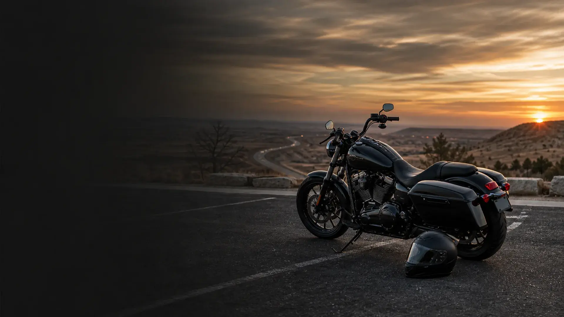 Motorcycle parked safely near a Lawton highway turnout with southwest Oklahoma prairie and sunset sky