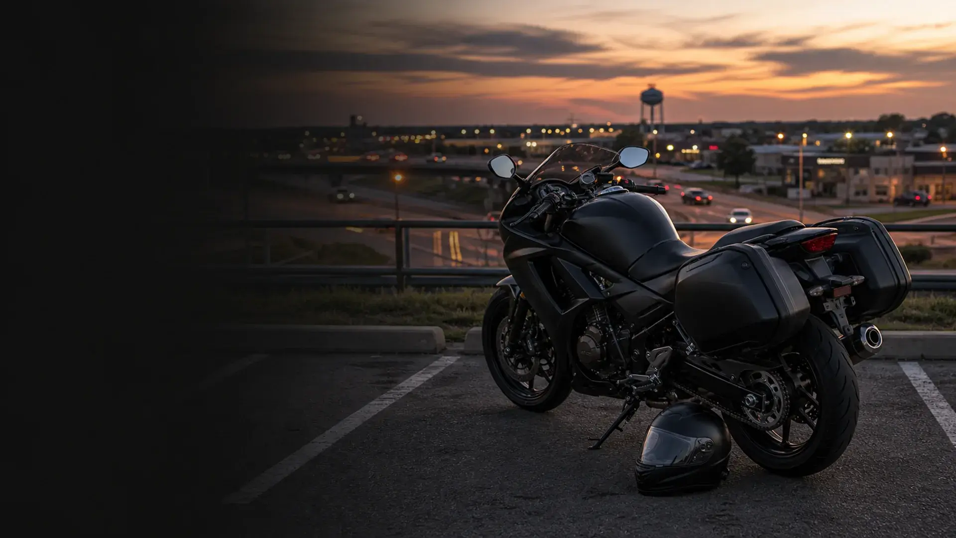 Motorcycle parked safely near a Shawnee central Oklahoma arterial and highway corridor at dusk