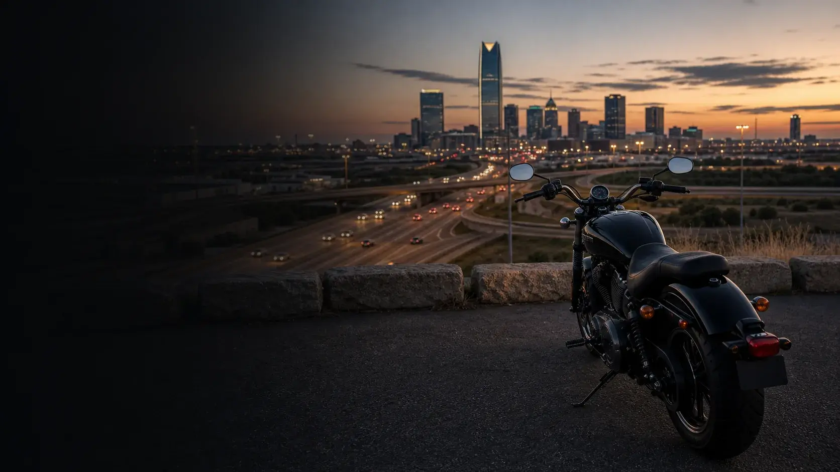Motorcycle parked safely above Oklahoma City interstate lanes at dusk